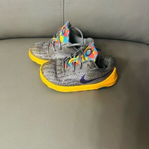 Nike Gray and Yellow Slip-On Sneakers with Rainbow Accents